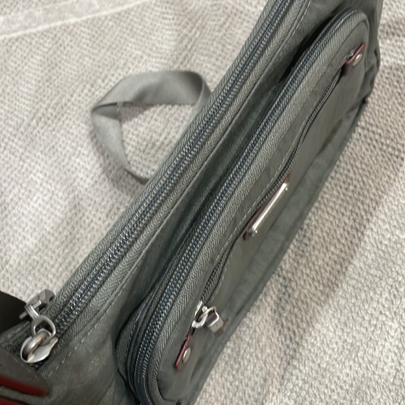 Baggallini. Brand new with tags. Grey with subtle cheetah print background. - Picture 3 of 12